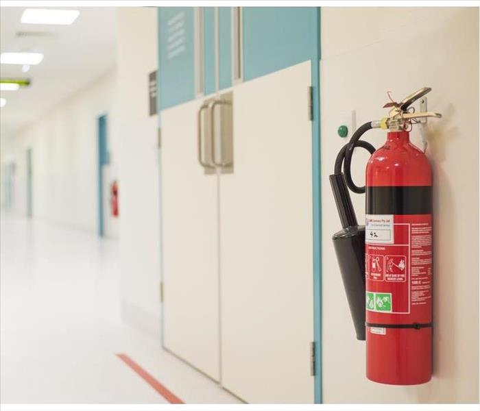 Fire extinguisher placed on a wall.