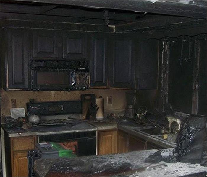 fire destroyed a kitchen, kitchen cabinets burned